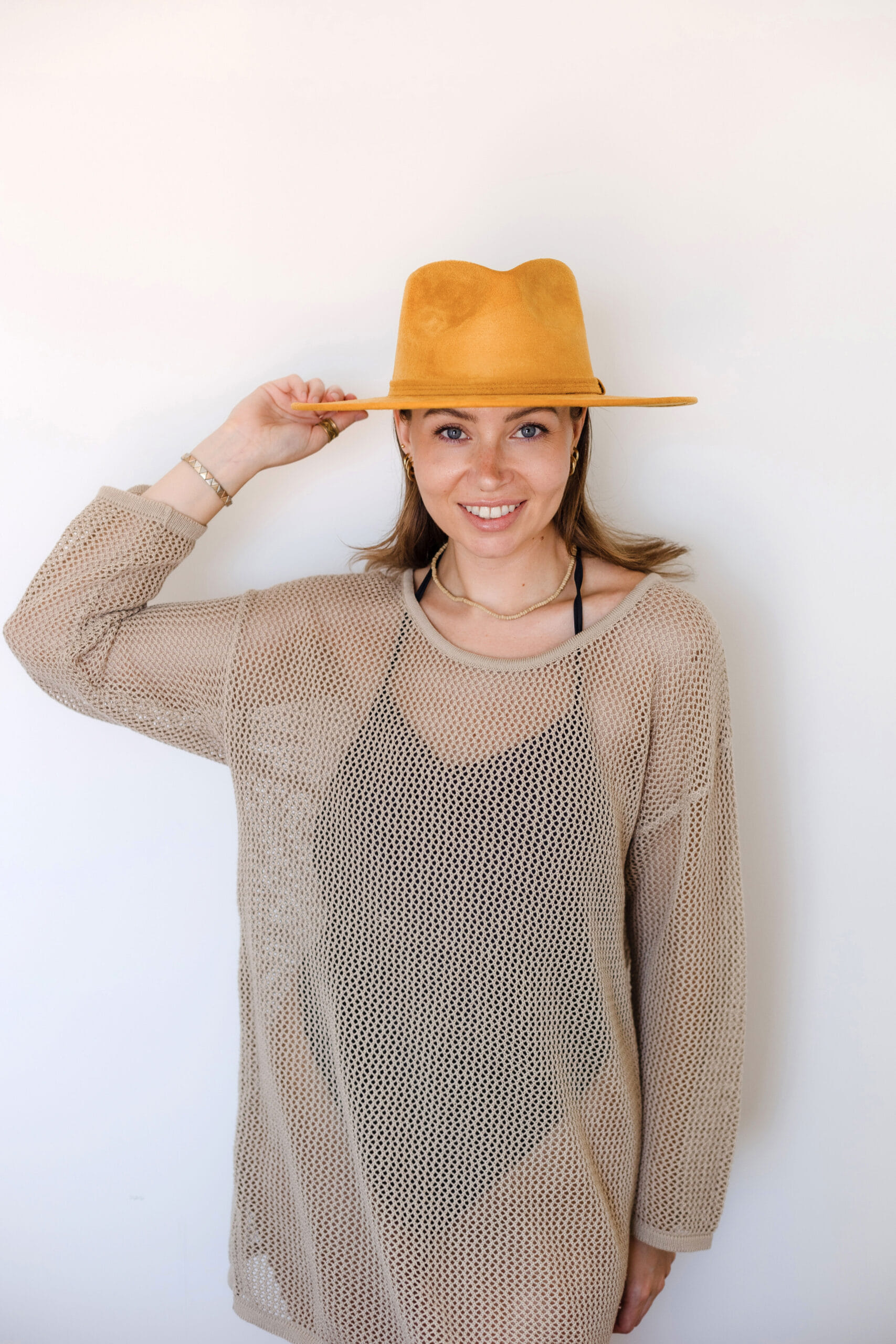 A yellow colored hat made in Mexico, made from synthetic suede front