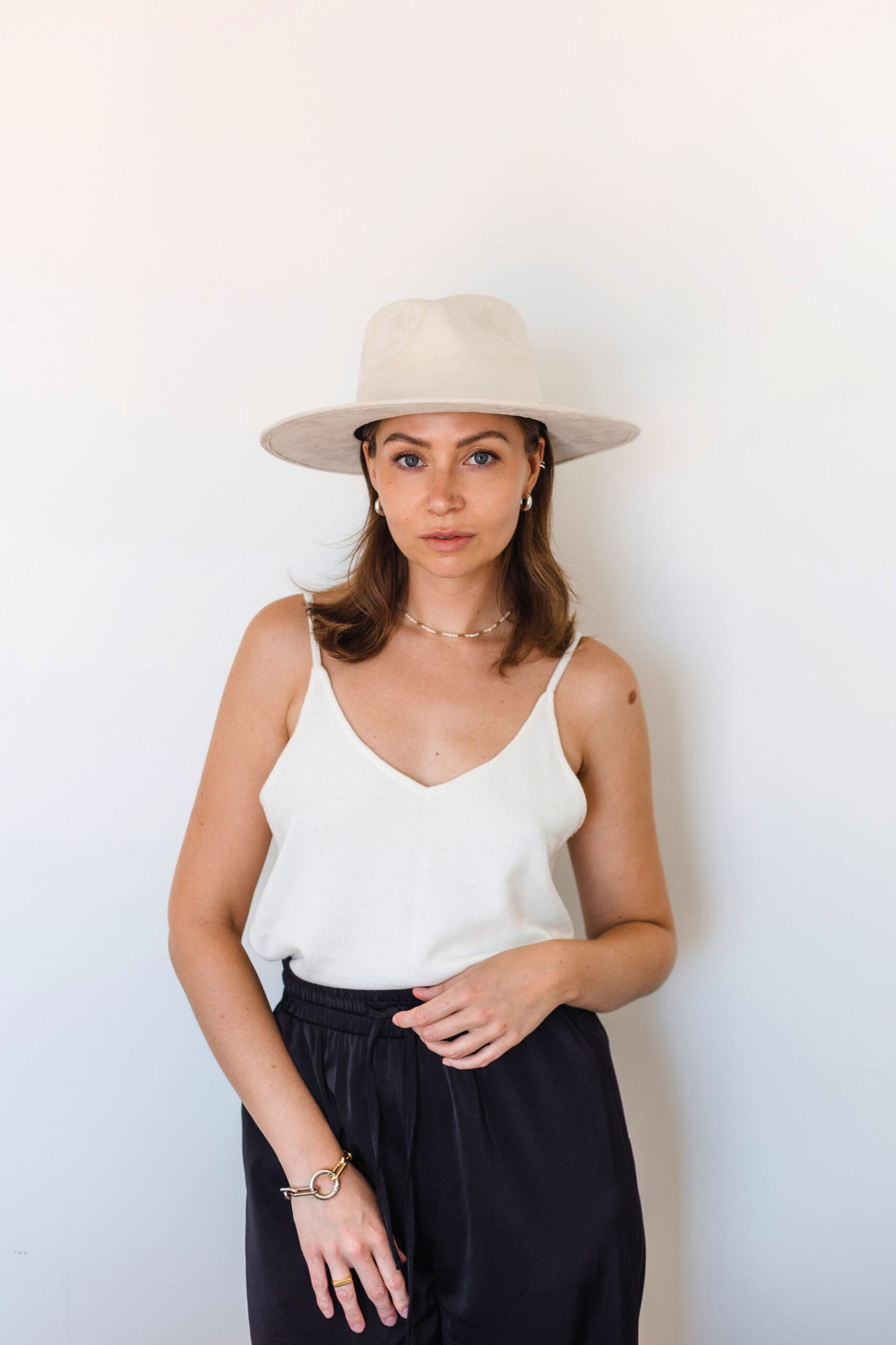 A cream colored hat made in Mexico, made from synthetic suede front