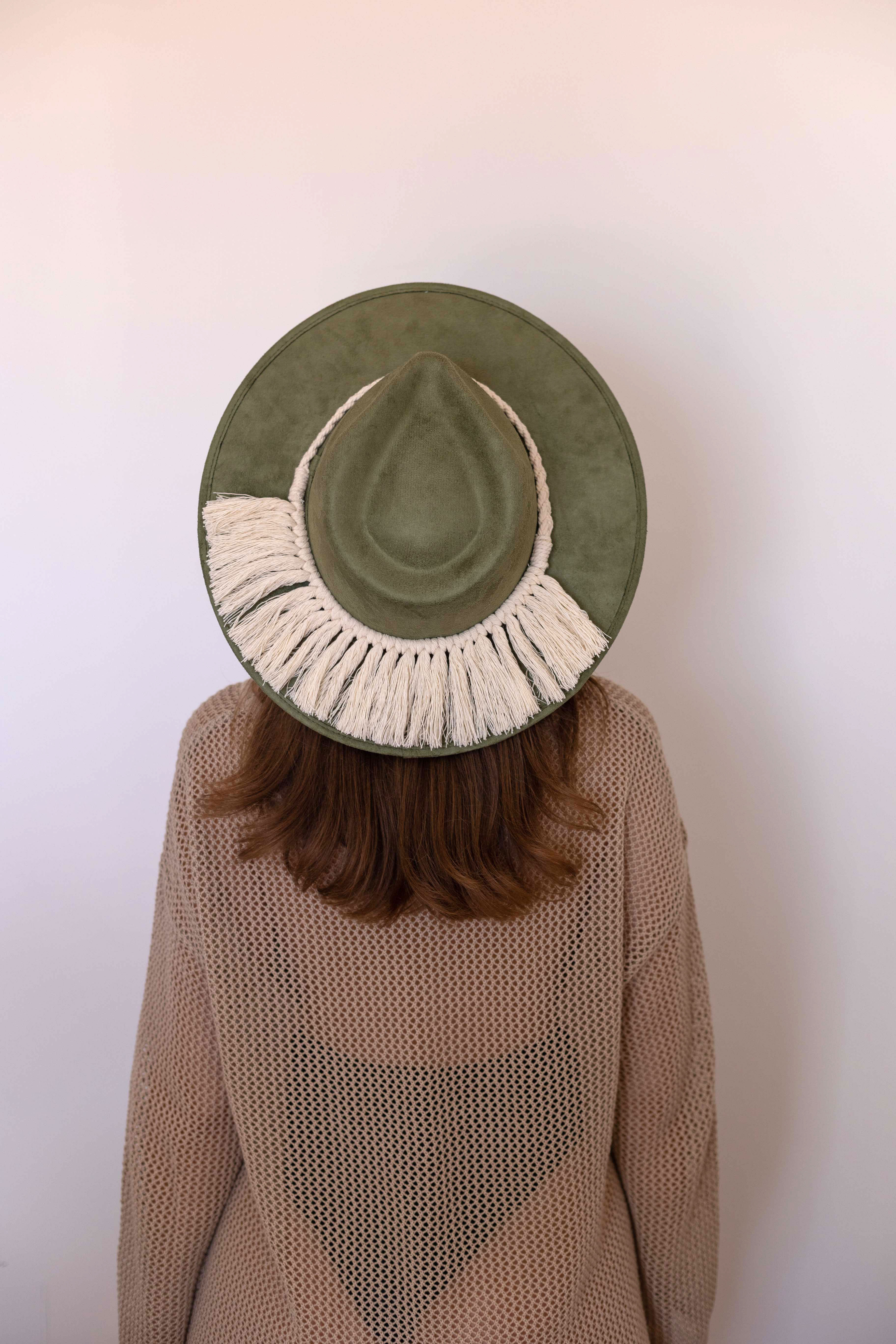 A cream colored hat accessory made in Mexico. Macrame stye âTulumâ