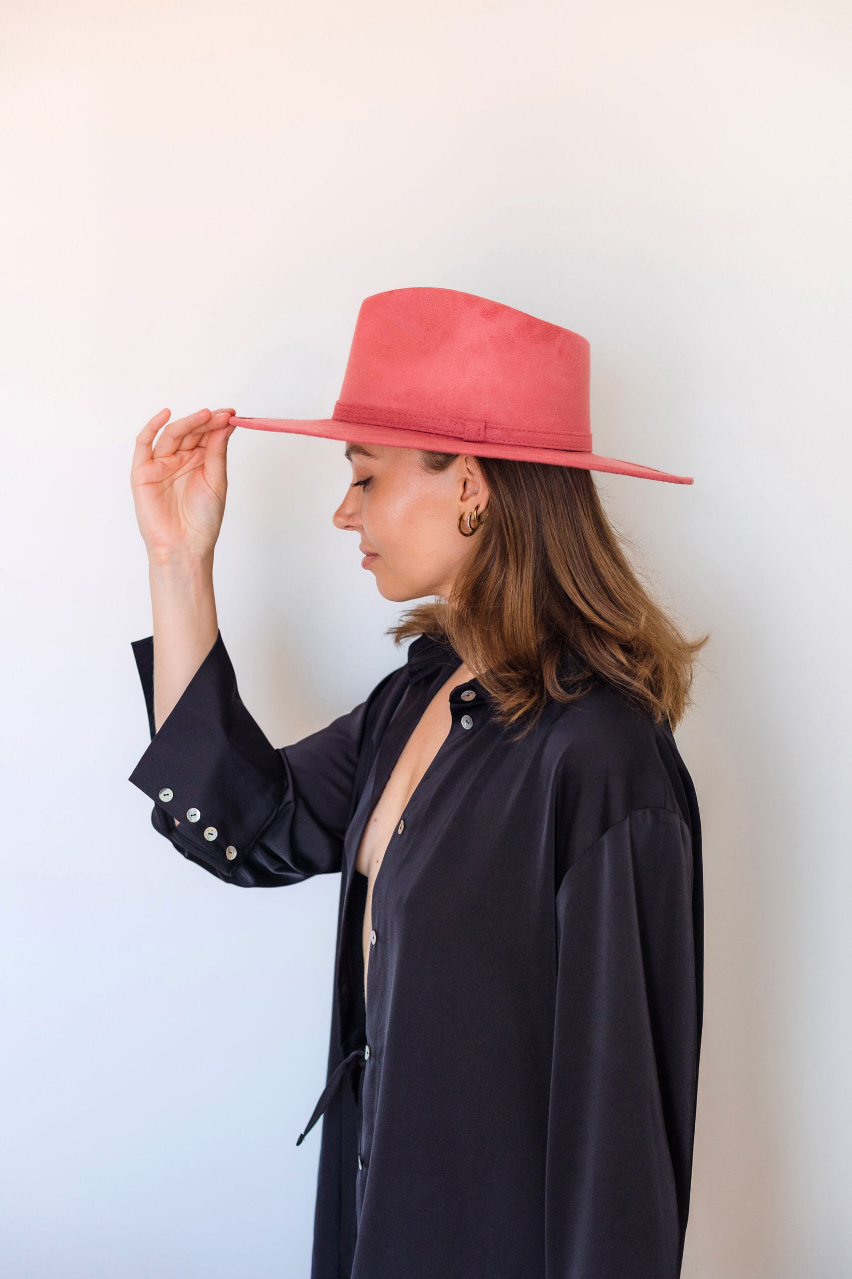 A pink colored hat made in Mexico, made from synthetic suede side