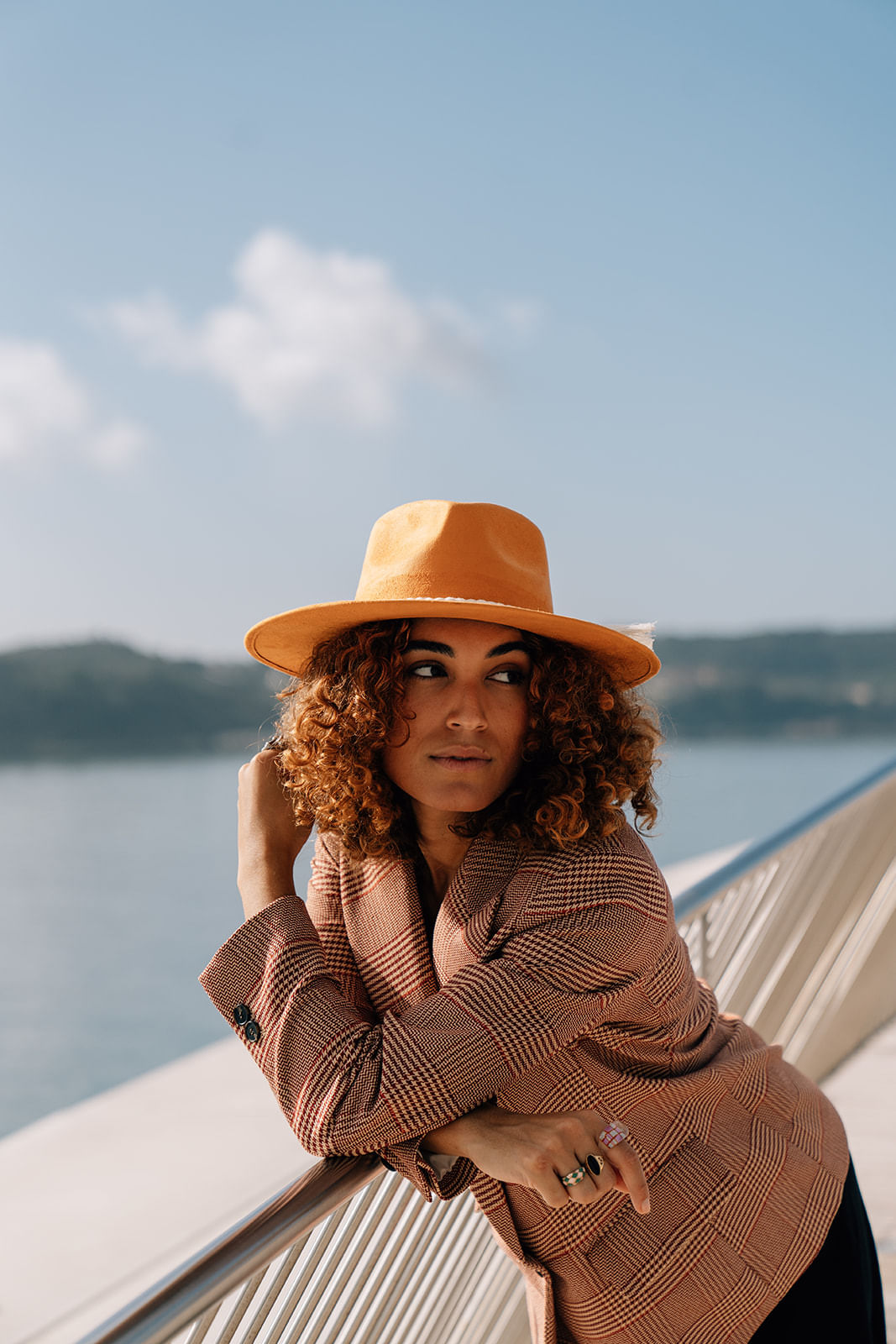 A pumpkin colored hat made in Mexico made from synthetic suede